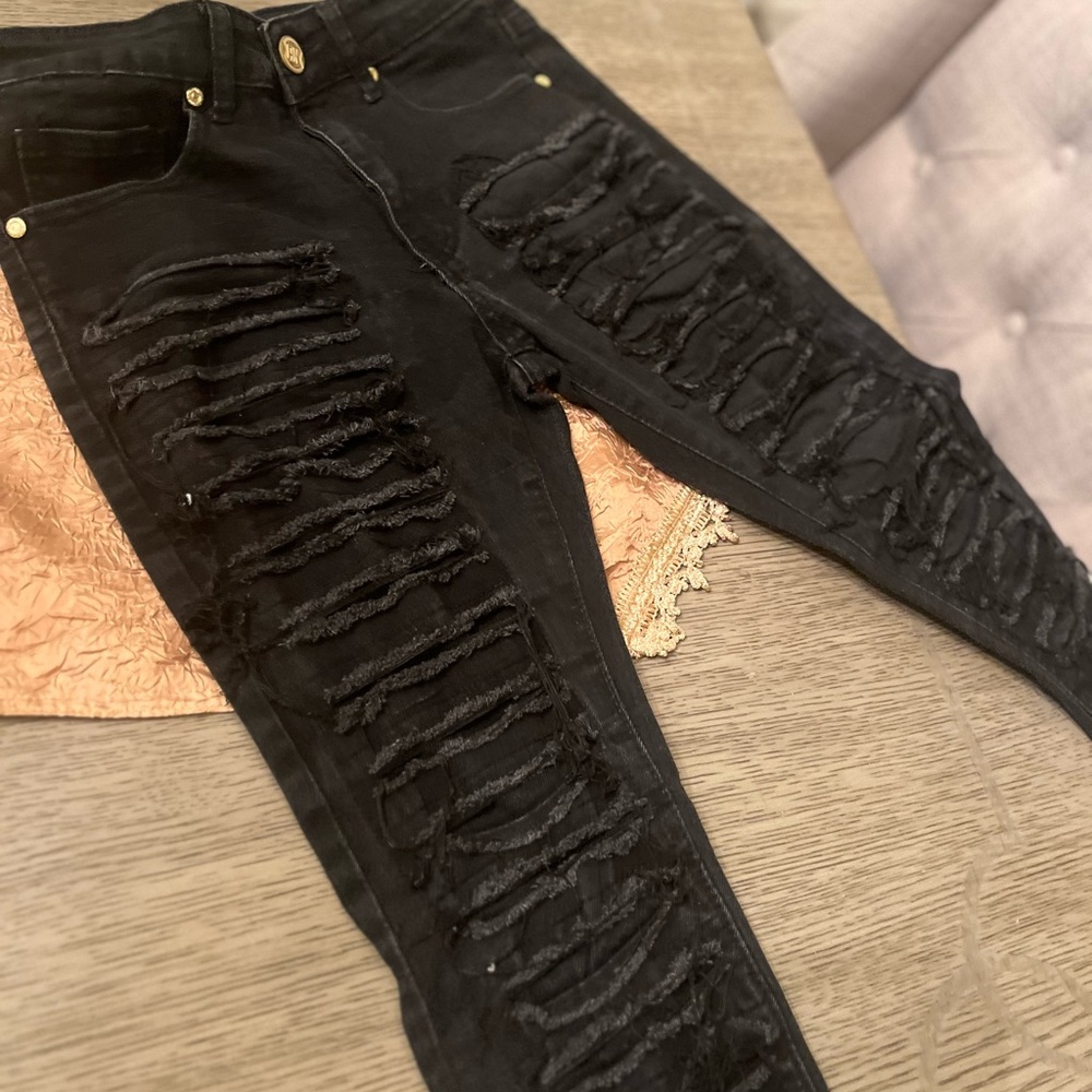 Stacked black jeans
